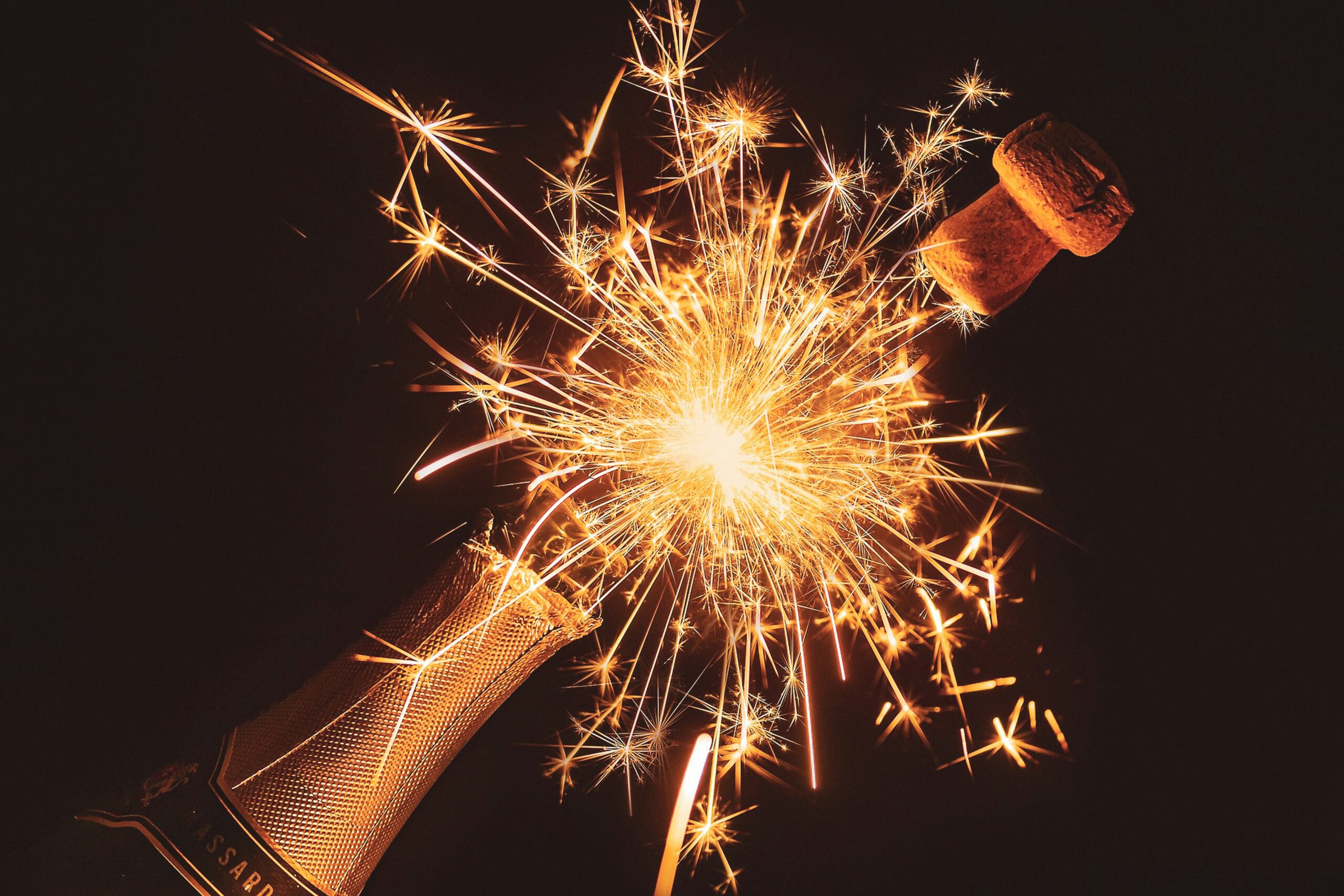 Champagne bottle popping with fireworks